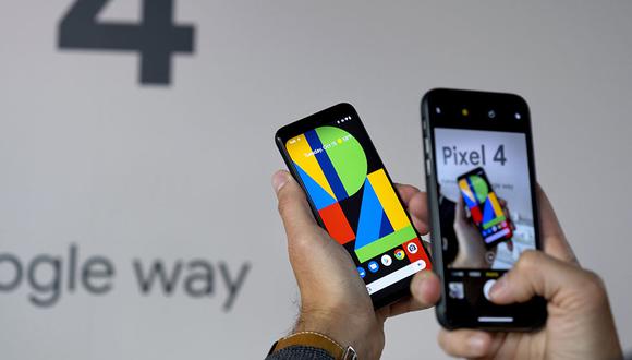 A Google Pixel 4 phone, center, is photographed at an event announcing the product Tuesday, Oct. 15, 2019, in New York. (AP Photo/Craig Ruttle)