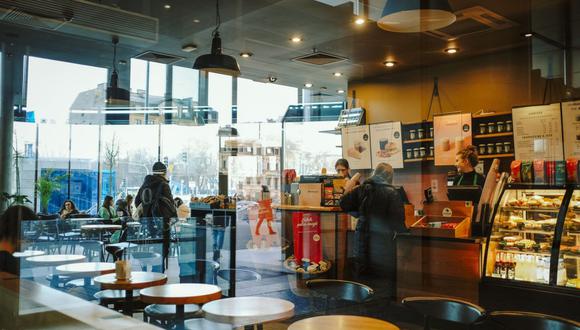 A customer orders at a Starbucks Corp. coffee store in Warsaw, Poland, on Wednesday, Jan. 4, 2023. Poland left borrowing costs unchanged as the threat of an economic recession overshadows concerns over the highest inflation in more than a quarter century.