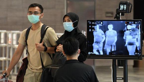 La situación en Singapur, donde el virus ha vuelto en los últimos días con fuerza pese a las temperaturas de 30º, ponen en duda la hipótesis de que los casos bajarán con el verano. (Getty Images).
