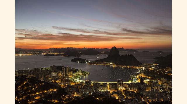 El sol se levanta detrás del monte Pan de Azúcar. Los Juegos Olímpicos de Río de Janeiro serán los de mayor cobertura televisiva en la historia del deporte. Sin embargo, ver esa ciudad por televisión no se puede comparar a la experiencia de estar realment