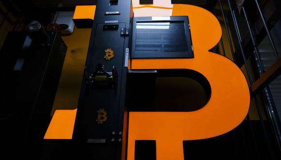 A Bitcoin logo on an automated teller machine (ATM) for cryptocurrencies at a crypto exchange kiosk in Warsaw, Poland, on Thursday, March 14, 2024. Bitcoin extended a retreat from its latest record high amid an intensifying debate about whether the bull run in cryptocurrencies is evidence of speculative froth in global markets. Photographer: Damian Lemanski/Bloomberg