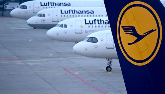 (FILES) The logo of German airline Lufthansa can be seen on the vertical stabilizer of a plane standing with other Lufthansa aircrafts at the airport in Frankfurt am Main, western Germany, on March 7, 2024. German airline Lufthansa on April 11, 2024 said it would continue to suspend flights to and from Tehran until April 13 due to tensions in the Middle East. "Due to the current situation, Lufthansa is suspending its flights to and from Tehran up to and including Saturday, 13 April, after careful evaluation," the airline said in a statement. (Photo by Kirill KUDRYAVTSEV / AFP)