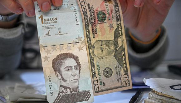 Acerca del cesta-ticket, un bono de alimentación que actualmente supone 3 bolívares (US$ 0.7), comentó que “hay una propuesta para aumentarlo a 45 bolívares”. (Foto: AFP)