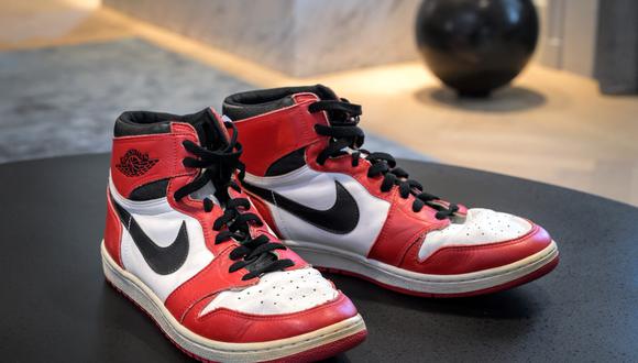 A pair of basketball legend Michael Jordan's famous Air Jordans from his rookie season are seen on April 28, 2021 in Geneva during a preview of sale by auction house Sotheby�s intitled �Gamers Only�. - Jordan's sneakers are estimated to sell for 100,000 to 150,000 Swiss francs ($109,500-$164,000; 90,500-136,000 euros), but could go much higher following the buzz created by a new world record this week. (Photo by Fabrice COFFRINI / AFP)