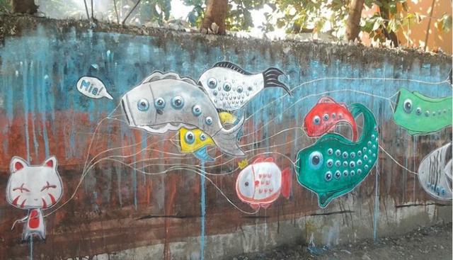 Grafiti realizado en las paredes de las calles de Filipinas. Su nombre, traducido al español, significa ‘Adorables raciones de ojos’. (Fuente: Google Art Project: Street Art)