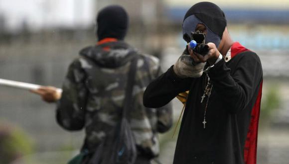 Encapuchados y armados con escopetas, estos grupos sembraron el terror en Venezuela. (Foto: AP)