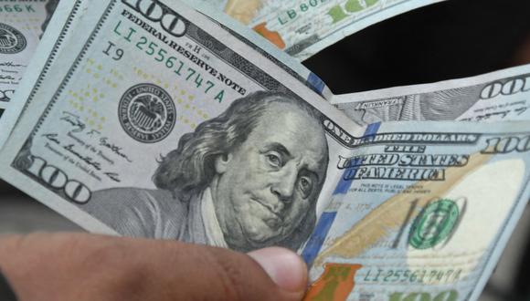 López de Washington Capital, proyecta que el dólar se seguirá fortaleciendo ante el sol y las principales monedas emergentes el 2023. (Foto: AFP)
