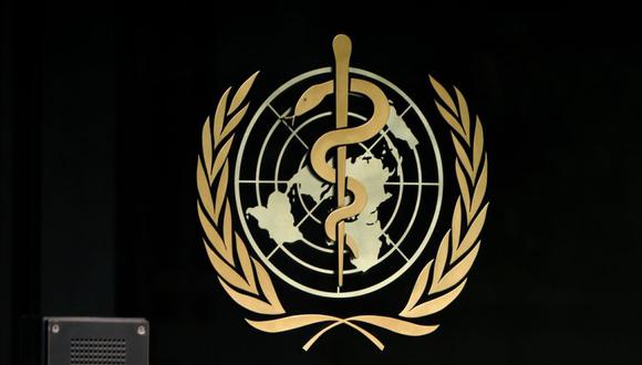A photo taken in the late hours of August 17, 2020 shows a sign of the World Health Organization (WHO) at the entrance of their headquarters in Geneva amid the COVID-19 outbreak, caused by the novel coronavirus. (Photo by Fabrice COFFRINI / AFP)