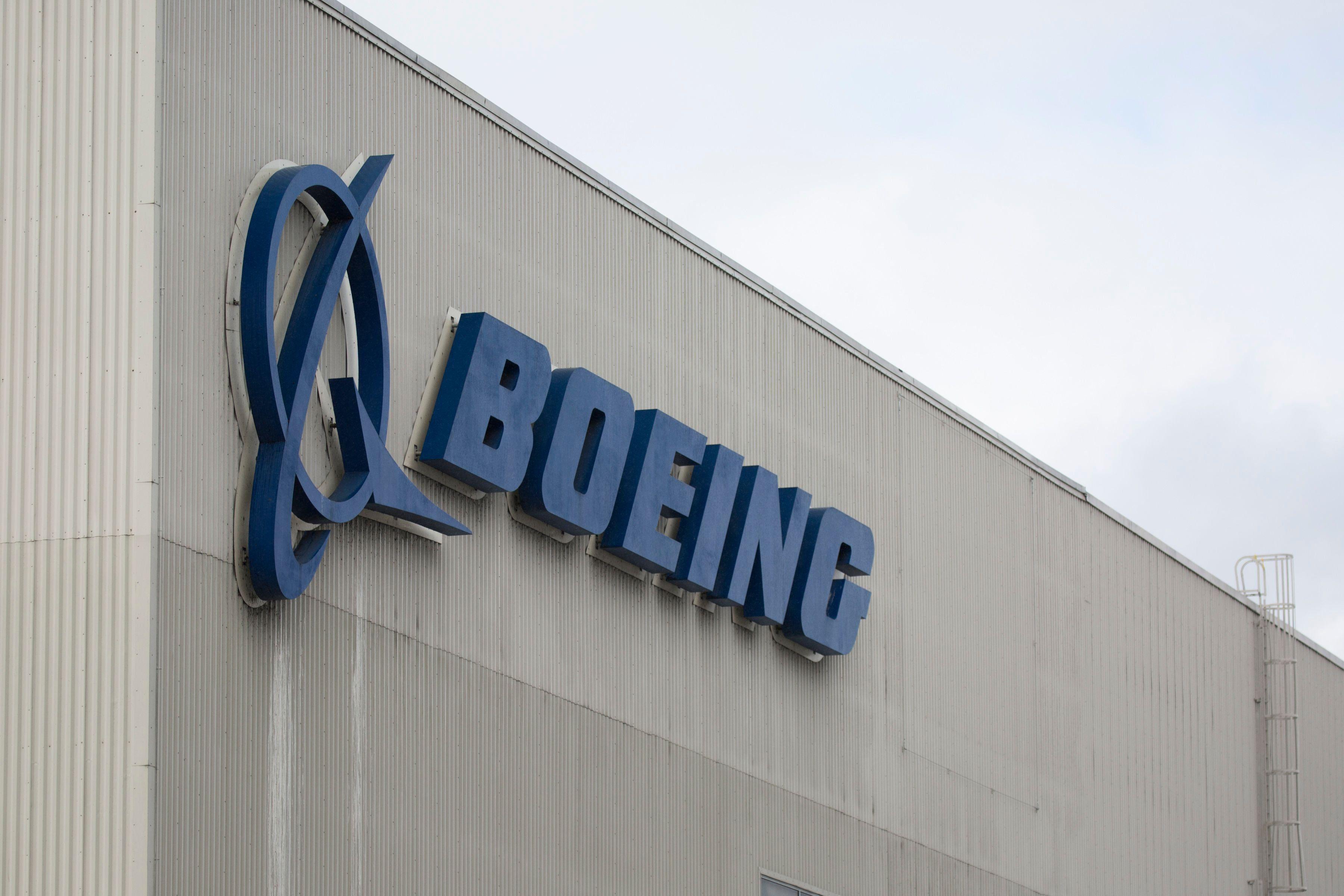 (FILES) In this file photo taken on March 12, 2019 the Boeing logo is pictured at the Boeing Renton Factory in Renton, Washington.  Boeing continues to target the fourth quarter for regulatory approval to return the 737 MAX to service after two deadly crashes, a spokesman said October 1, 2019. Boeing last week organized simulator tests for pilots from leading US carriers on new systems upgraded after two deadly MAX crashes. Boeing's changes received positive feedback, according to people familiar with the matter, boosting Boeing's hopes of meeting its target date. / AFP / Jason Redmond
