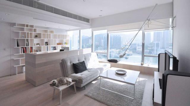 Boathouse Home Office (Hong Kong, China). Bean Buro diseñó el departamento con grandes ventanas panorámicas con vista a los botes de Aberdeen para crear un ambiente balanceado y calmado.