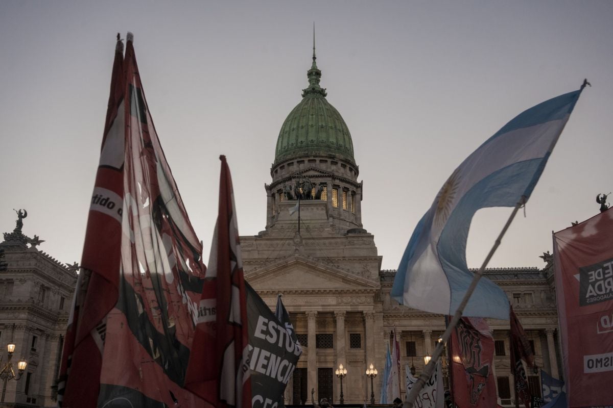 Demonstrators during a protest against the "omnibus" bill in front of the National Congress in Buenos Aires, Argentina, on Friday, Feb. 2, 2024. Argentina's lower house of congress approved President Javier Mileis omnibus reform package Friday afternoon, passing the first test of his ability to govern with an opposition-controlled legislature.