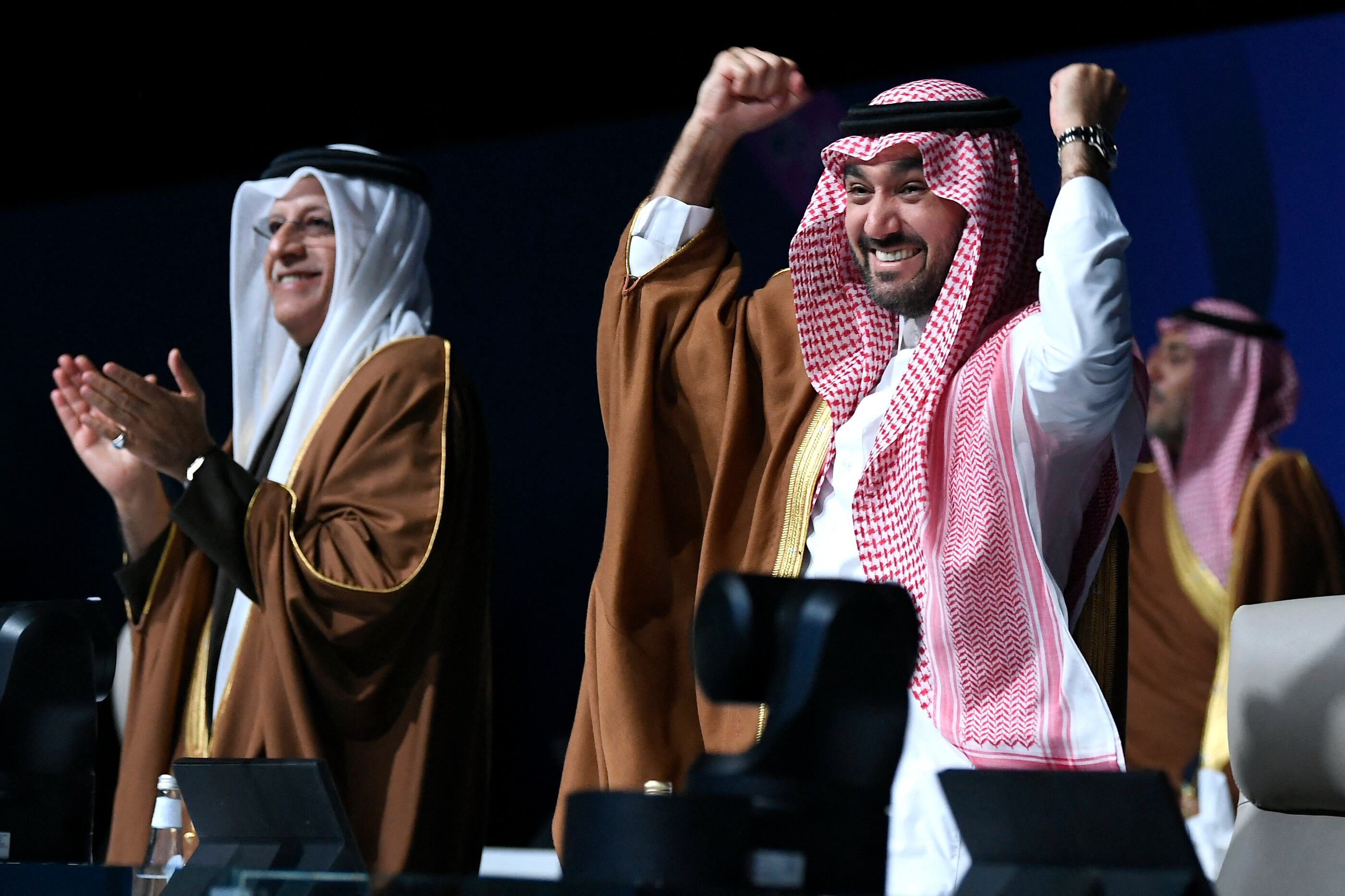 Asian Football Confederation (AFC) President Sheikh Salman bin Ibrahim al-Khalifa (L) and Saudi Arabia's Minister of Sports and Youth Abdulaziz bin Turki al-Faisal al-Saud celebrate after Saudi Arabia was confirmed as host of the 2034 World Cup during a ceremony in the capital Riyadh on December 11, 2024. Saudi Arabia was confirmed as host of the 2034 World Cup by FIFA on December 11, underlining the Gulf kingdom's growing influence in world sport despite criticism of the country's human rights record. (Photo by AFP)