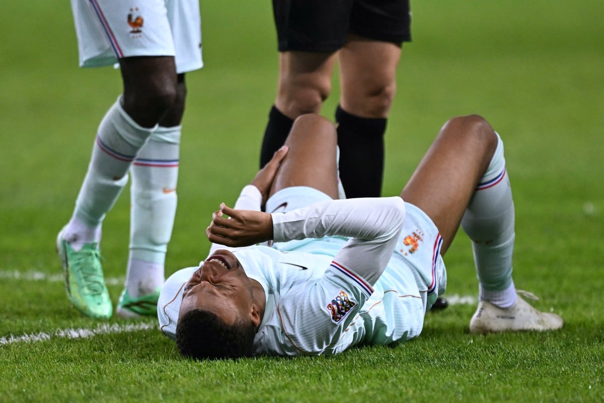 France's forward #10 Kylian Mbappe reacts after scoring the opening goal and to a leg pain during the UEFA Nations League (League A, Group 1) first leg football match between Turkey and France at the Kocaeli Stadium in Izmit, on September 25, 2026. (Photo by OZAN KOSE / AFP)