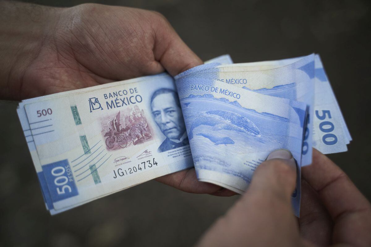 Mexican 500 peso banknotes arranged in Axtla de Terrazas, San Luis Potosi, Mexico, on Sunday, April 2, 2023. The Mexican peso is down 0.2% after inflation came in marginally below estimates, strengthening the view that the monetary tightening cycle may be over.