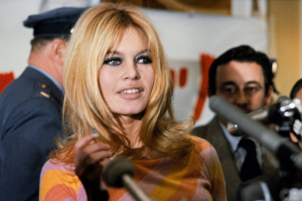 (FILES) French actress Brigitte Bardot (C) gives a press conference on December 1965 in Hollywood for the film "Viva Maria", directed by Louis Malle (background). The American film "Dear Brigitte" (Ch�re Brigitte), directed by Henry Koster, was released at the same year. Brigitte Bardot, legendary French actress, female icon of the 1960s and fervent animal rights activist, has died at the age of 91, the Brigitte Bardot Foundation announced on December 28, 2025. (Photo by AFP)