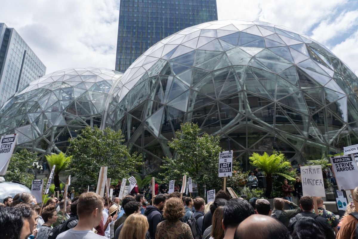 Amazon employees during a walkout outside the Amazon Spheres, part of the Amazon headquarters campus, in Seattle, Washington, US, on Wednesday, May 31, 2023. The Amazon.com Inc. employees are demanding more flexibility with remote work and more attention on Amazon's climate impact.