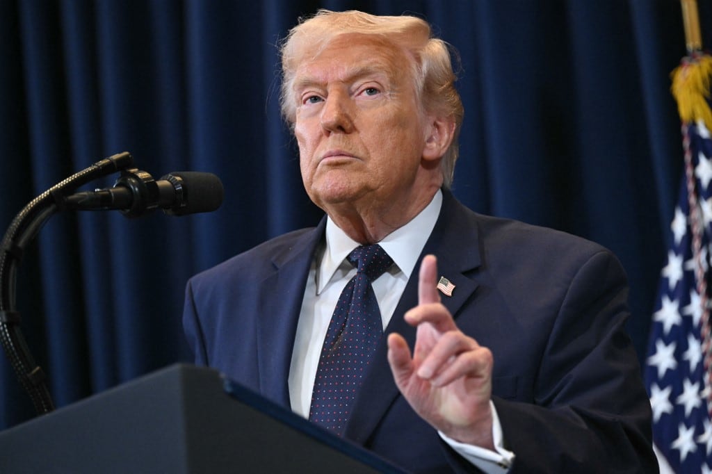 US President Donald Trump speaks during a press conference at Trump National Doral in Miami, Florida, on March 9, 2026. President Trump on Monday threatened a larger attack on Iran if it blocks supplies of oil, whose prices have spiked over the Middle East war. (Photo by SAUL LOEB / AFP)