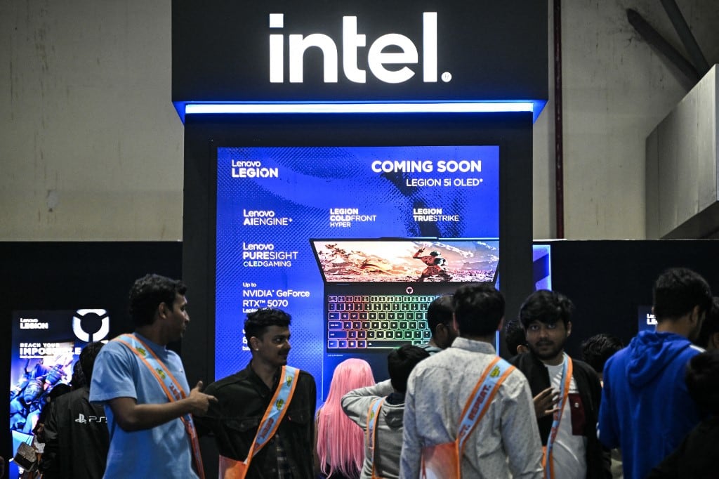 Visitors gather at a stall of US chipmaker Intel during the Bengaluru Comic Con 2025 fest in Bengaluru on December 21, 2025. (Photo by Idrees MOHAMMED / AFP)