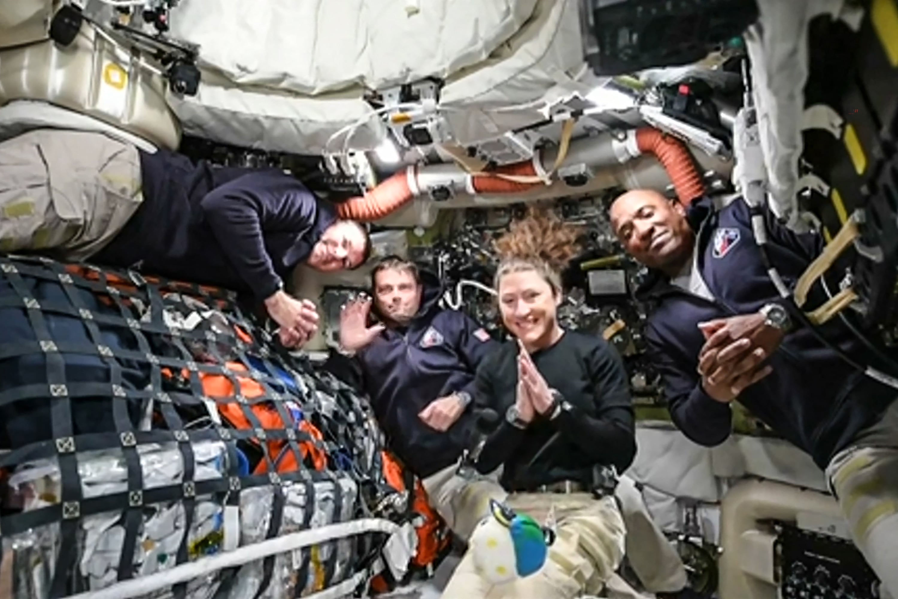 This screen grab from NASA's feed released on April 3, 2026, shows the four Artemis II crew members (L-R) Canadian Space Agency (CSA) astronaut Jeremy Hansen, Artemis II mission specialist, NASA astronauts Reid Wiseman, Artemis II commander, Christina Koch, Artemis II mission specialist and Victor Glover, Artemis II pilot as they head to orbit the Moon for the first time in more than half a century. The spacecraft lifted off from Kennedy Space Center in Florida at 18:35 EDT the previous day. (Photo by Handout / NASA TV / AFP) / RESTRICTED TO EDITORIAL USE - MANDATORY CREDIT "AFP PHOTO / NASA" - HANDOUT - NO MARKETING NO ADVERTISING CAMPAIGNS - DISTRIBUTED AS A SERVICE TO CLIENTS
