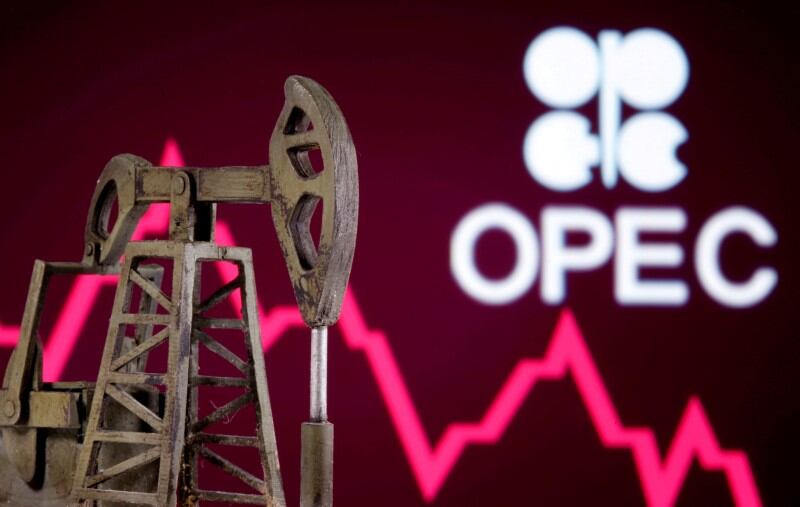 FILE PHOTO: A 3D printed oil pump jack is seen in front of displayed stock graph and Opec logo in this illustration picture, April 14, 2020. REUTERS/Dado Ruvic