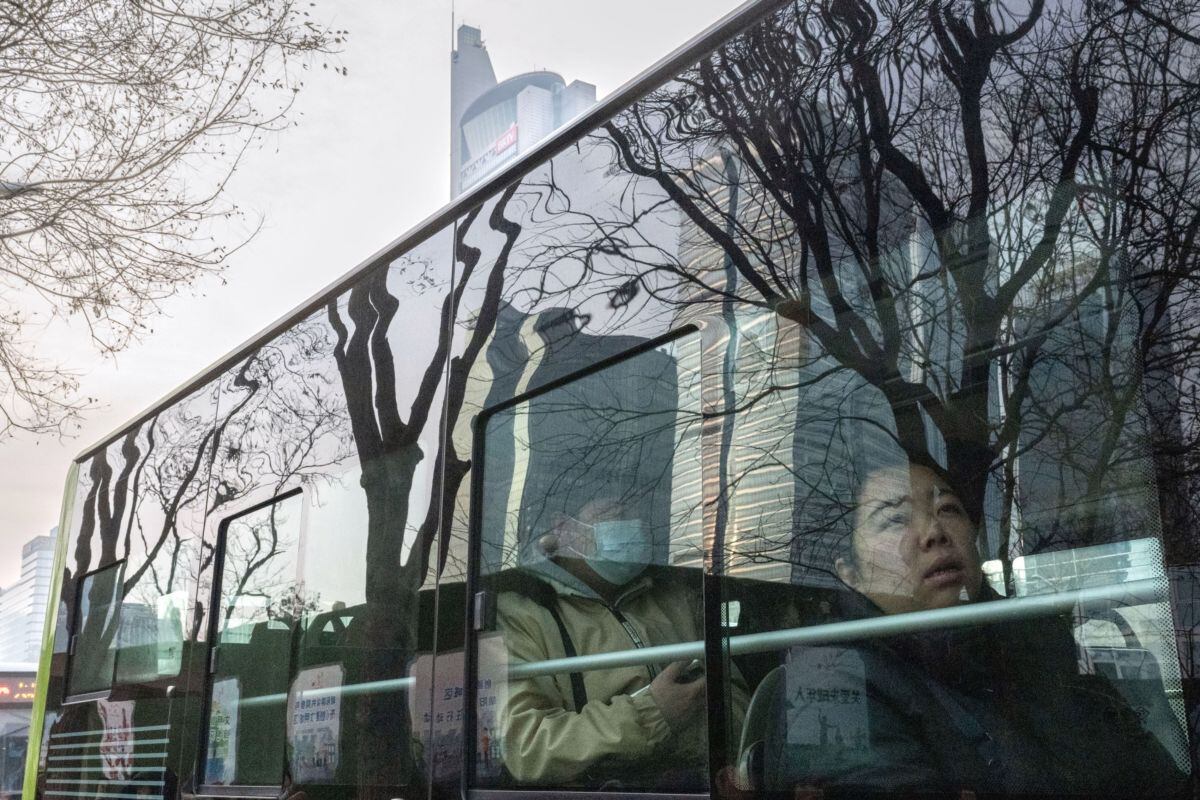 Passengers ride a bus in Beijing, China, on Tuesday, Jan. 2, 2024. Chinese President Xi Jinping pledged to strengthen economic momentum and job creation, acknowledging some companies and citizens had endured a difficult 2023 in a rare admission of domestic headwinds facing the country.