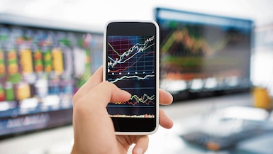 Businessman analysis stockmarket with digital tablet and laptop in office