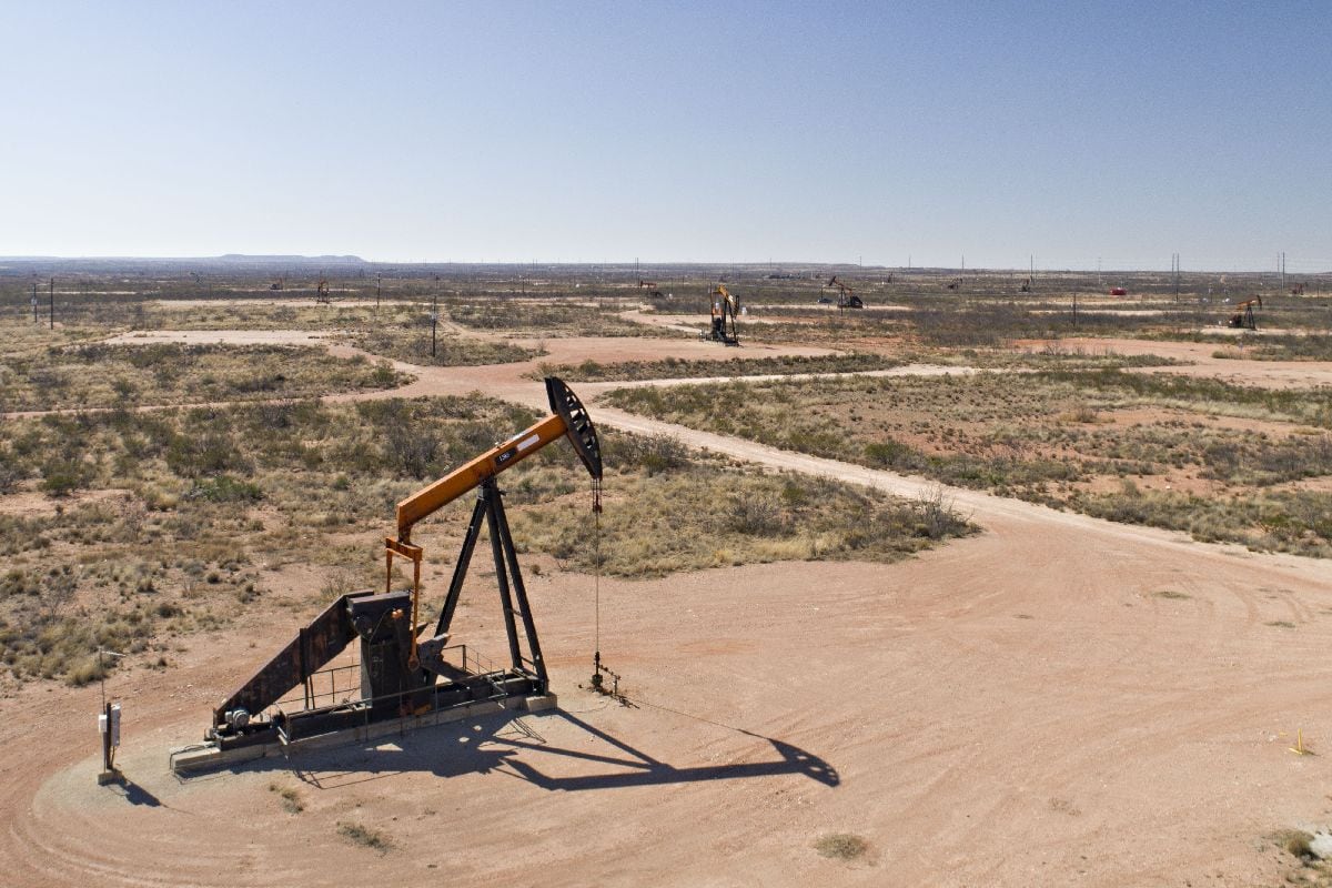 Pumpjacks operate on oil wells in the Permian Basin in Crane, Texas.