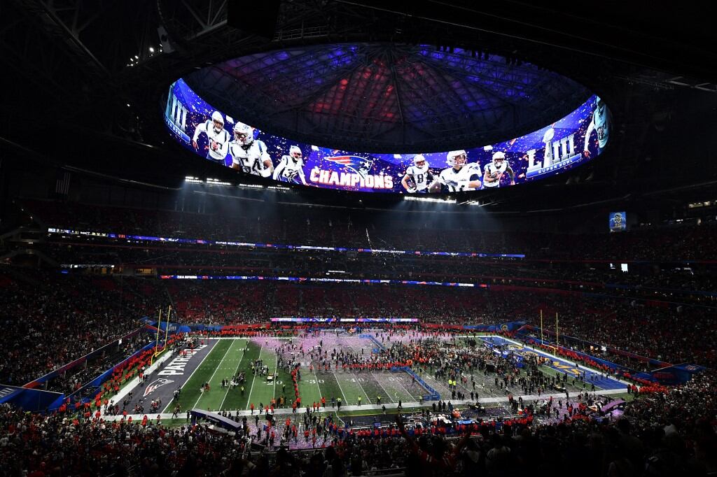 Confetti falls onto the pitch after the New England Patriots won Super Bowl LIII against the Los Angeles Rams at Mercedes-Benz Stadium in Atlanta, Georgia, on February 3, 2019. (Photo by Angela Weiss / AFP)