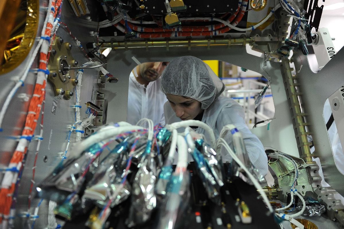 Technicians work on the assembly line of Globalstar satellites. Photographer: Vincenzo Pinto/AFP/Getty Images