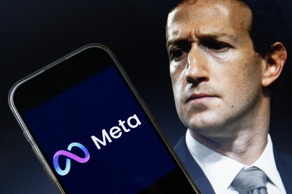 This photo illustration created on January 7, 2025, in Washington, DC, shows an image of Mark Zuckerberg, CEO of Meta, and an image of the Meta logo. Social media giant Meta on January 7, 2025, slashed its content moderation policies, including ending its US fact-checking program, in a major shift that conforms with the priorities of incoming president Donald Trump. (Photo by Drew ANGERER / AFP)