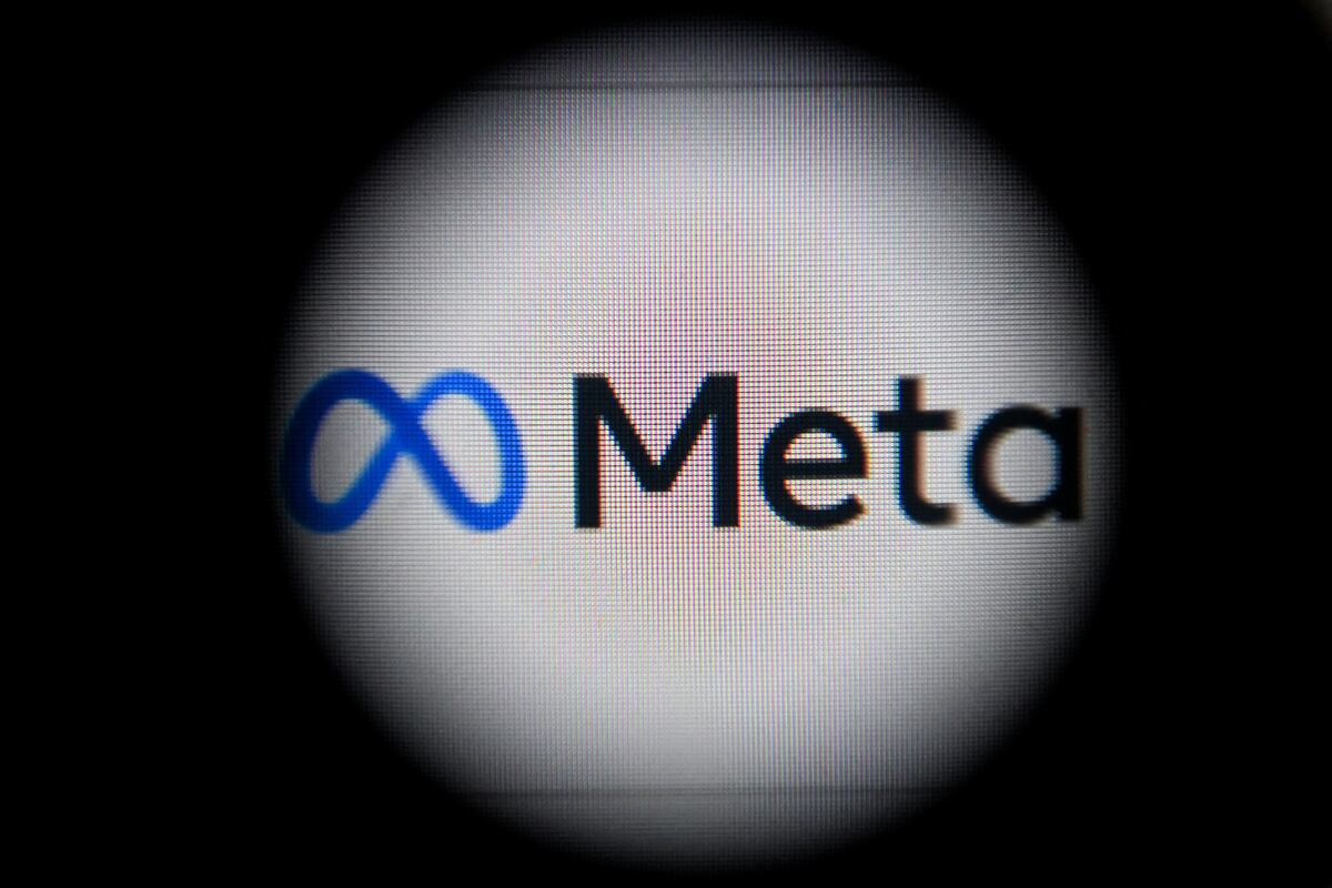 This photograph taken on October 28, 2021 shows the META logo on a laptop screen in Moscow as Facebook chief Mark Zuckerberg announced the parent company's name is being changed to "Meta" to represent a future beyond just its troubled social network. - The new handle comes as the social media giant tries to fend off one its worst crises yet and pivot to its ambitions for the "metaverse" virtual reality version of the internet that the tech giant sees as the future. (Photo by Kirill KUDRYAVTSEV / AFP)