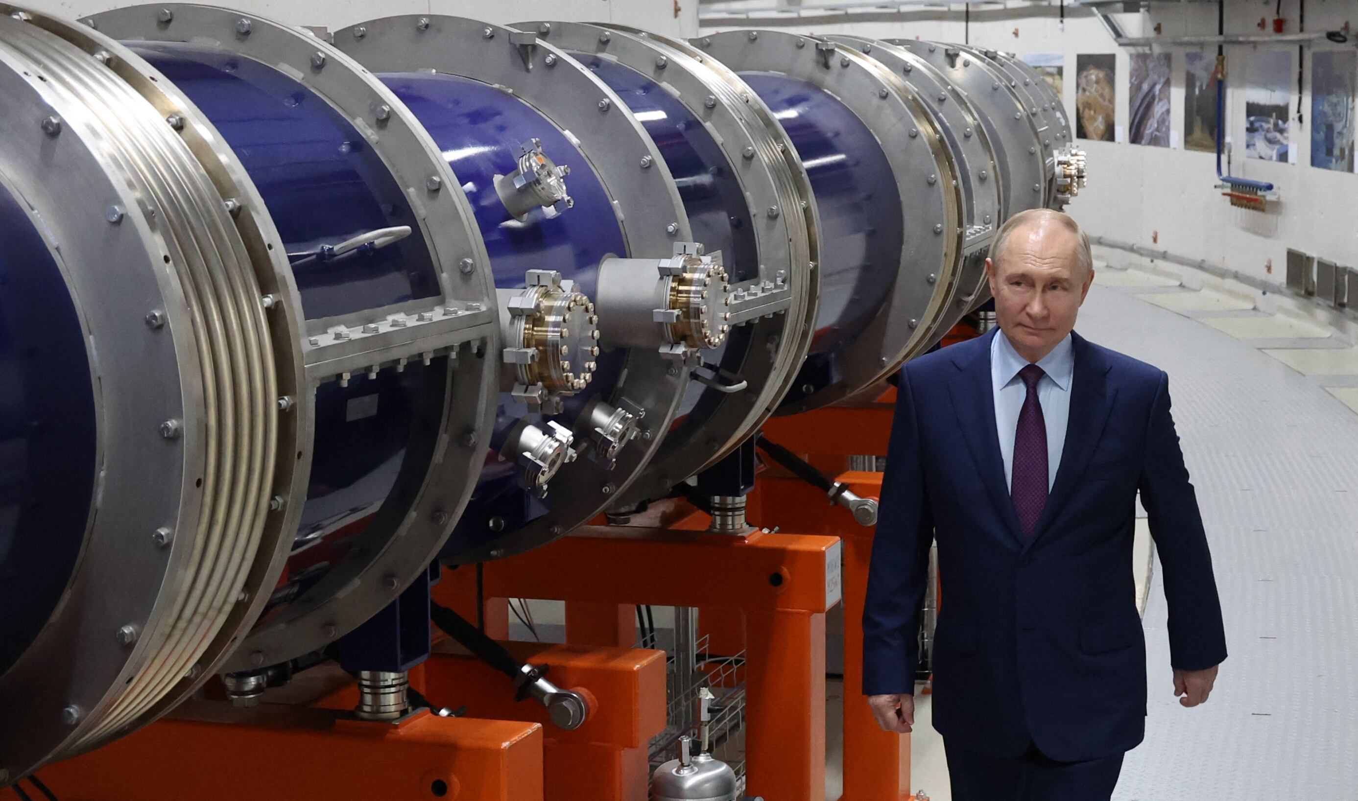 In this pool photograph distributed by the Russian state agency Sputnik, Russia's President Vladimir Putin sees the heavy-ion collider ring of the NICA (Nuclotron-based Ion Collider Fa?ility) complex at the Joint Institute for Nuclear Research in Dubna in the Moscow region on June 13, 2024. (Photo by Alexander KAZAKOV / POOL / AFP)