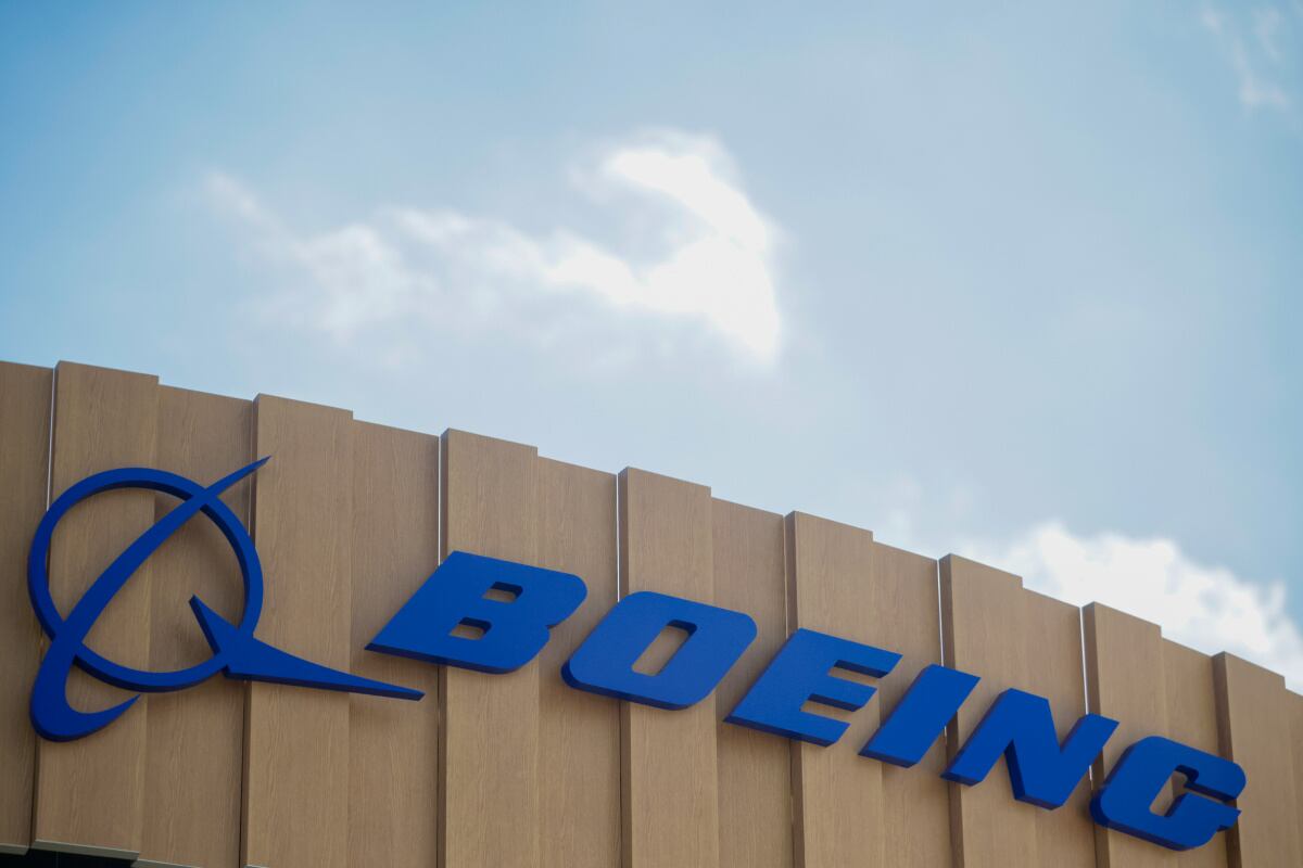 The Boeing Co. logo on the company's stand during the opening day of the Farnborough International Airshow in Farnborough, UK, on Monday, July 22, 2024. The aviation summit is typically a platform for planemakers to rack up multibillion-dollar deals.