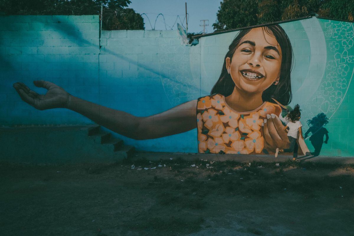A girl plays in the street in the La Campanera neighborhood. Photographer: Carlos Barrera/Bloomberg