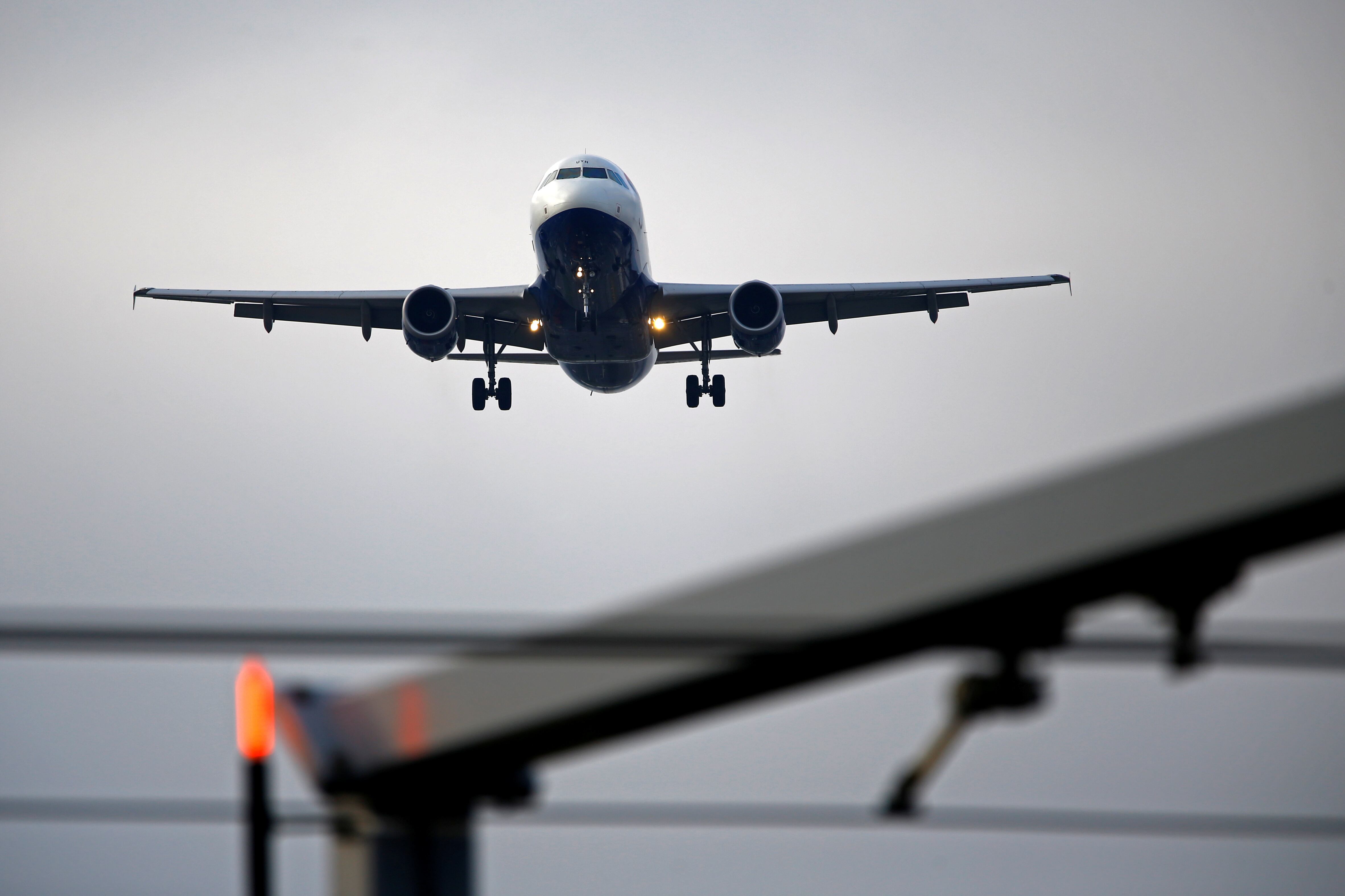 FILE PHOTO: An airplane prepares to land at Cointrin airport in Geneva, Switzerland December 5, 2017. REUTERS/Pierre Albouy