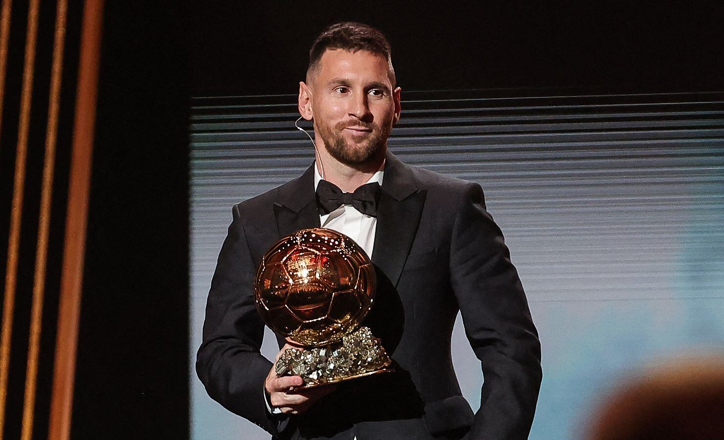 Inter Miami CF's Argentine forward Lionel Messi holds his trophy on stage as he receives his 8th Ballon d'Or award during the 2023 Ballon d'Or France Football award ceremony at the Theatre du Chatelet in Paris on October 30, 2023. (Photo by FRANCK FIFE / AFP)