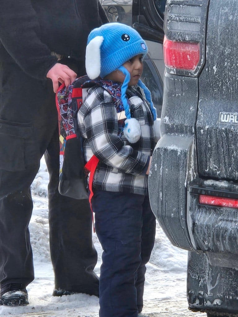 This photo obtained on January 23, 2026, courtesy of Columbia Heights Public Schools, shows an ICE agent holding onto the backpack of a five-year-old student at Valley View Elementary, Liam Conejo Ramos, as he is being detained on January 20, 2026 in Minneapolis, Minnesota. Outrage grew on January 23 at the detention of a five-year-old boy in a massive immigration crackdown in Minneapolis, as US Vice President JD Vance defended federal agents' actions.
Thousands of Immigration and Customs Enforcement (ICE) agents have been deployed to the Democratic-led city, as the administration of President Donald Trump presses its campaign to deport what it says are millions of illegal immigrants across the country. (Photo by Handout / Columbia Heights Public Schools / AFP) / RESTRICTED TO EDITORIAL USE - MANDATORY CREDIT "AFP PHOTO / COLUMBIA HEIGHTS PUBLIC SCHOOLS/HANDOUT" - NO MARKETING - NO ADVERTISING CAMPAIGNS - DISTRIBUTED AS A SERVICE TO CLIENTS