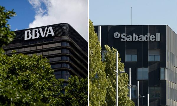 The Spanish bank BBVA and the Sabadell Bank Photographer: Dani Pozo; Joseph Lago/AFP/Getty Images