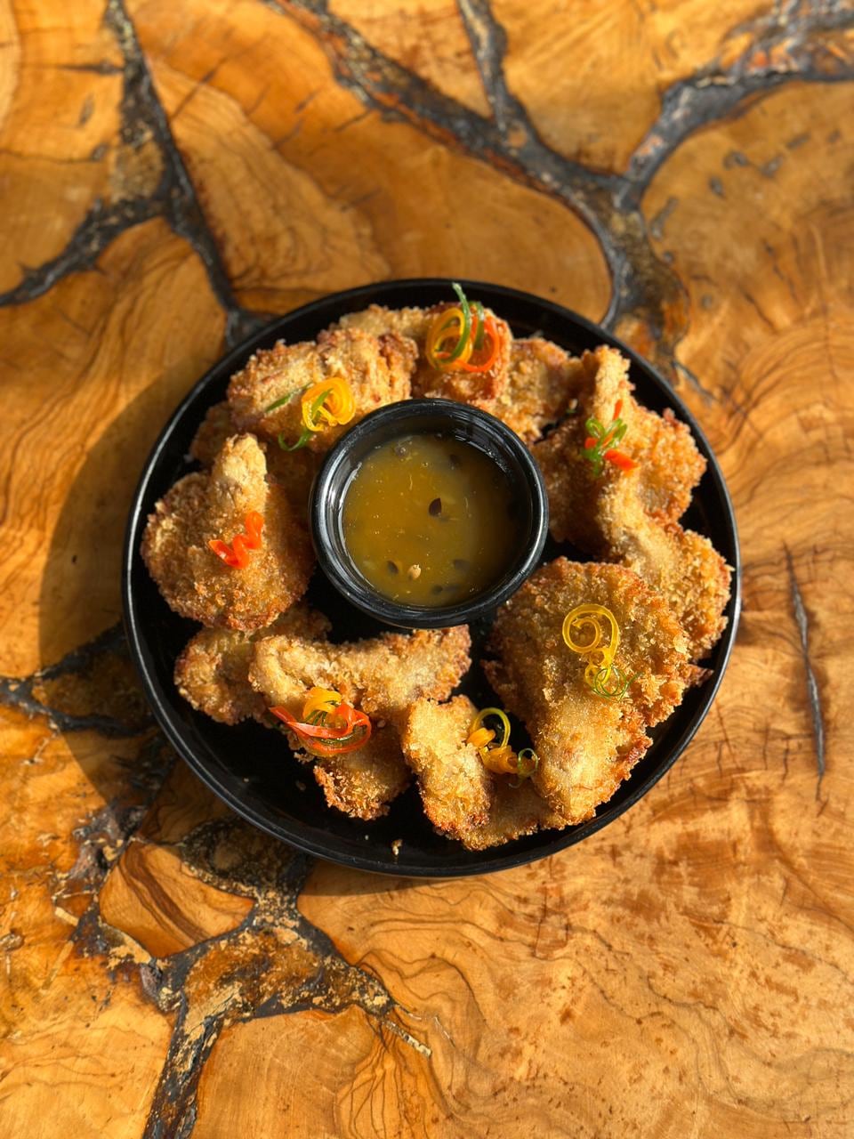 Don Melchor también apuesta por preparaciones como hongos ostra con panko y salsa de maracuya en Don Melchor. (Foto: Don Melchor).