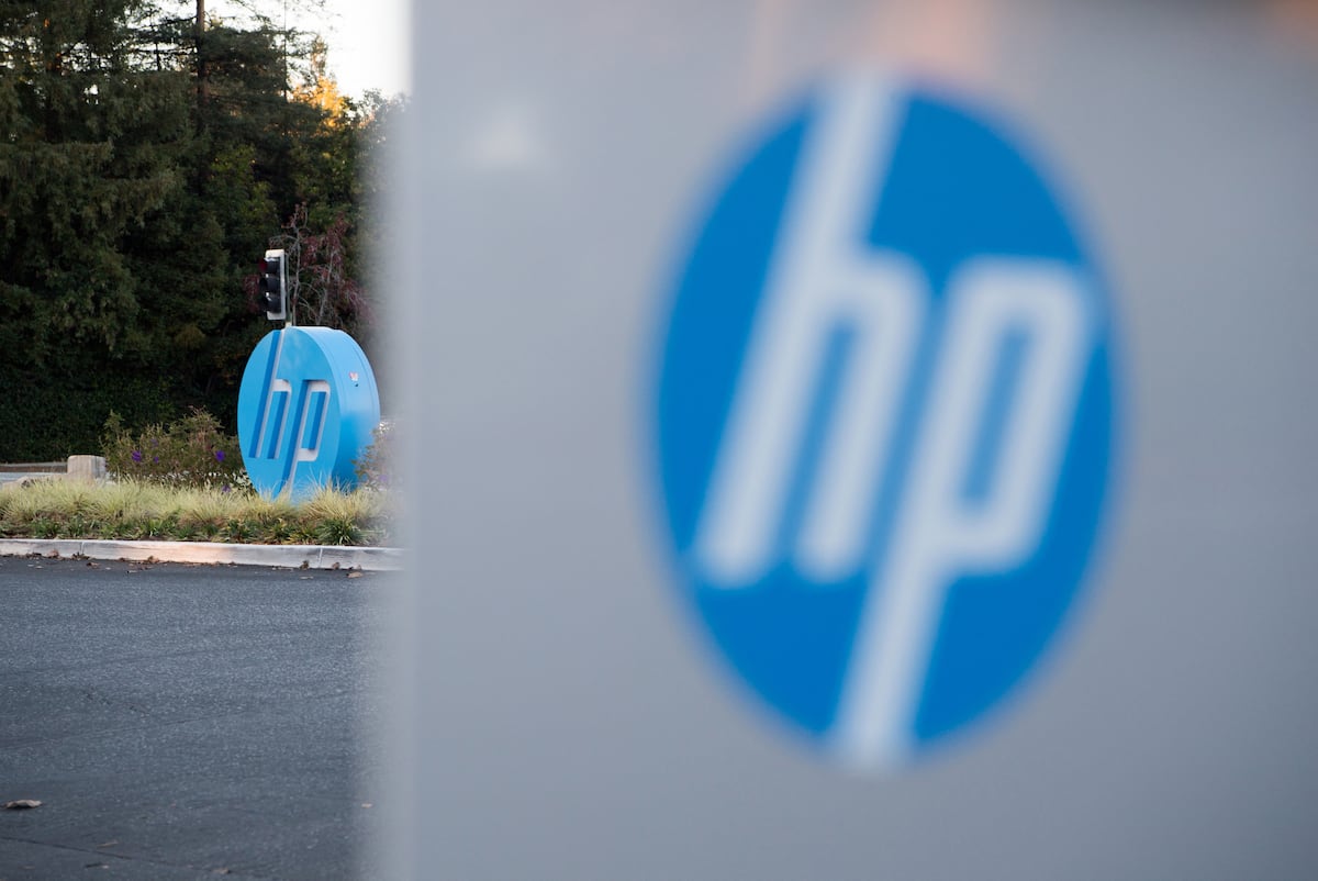 The HP logo is seen on a sign at Hewlett Packard's headquarters in Palo Alto, California on November 4, 2016. (Photo by JOSH EDELSON / AFP)