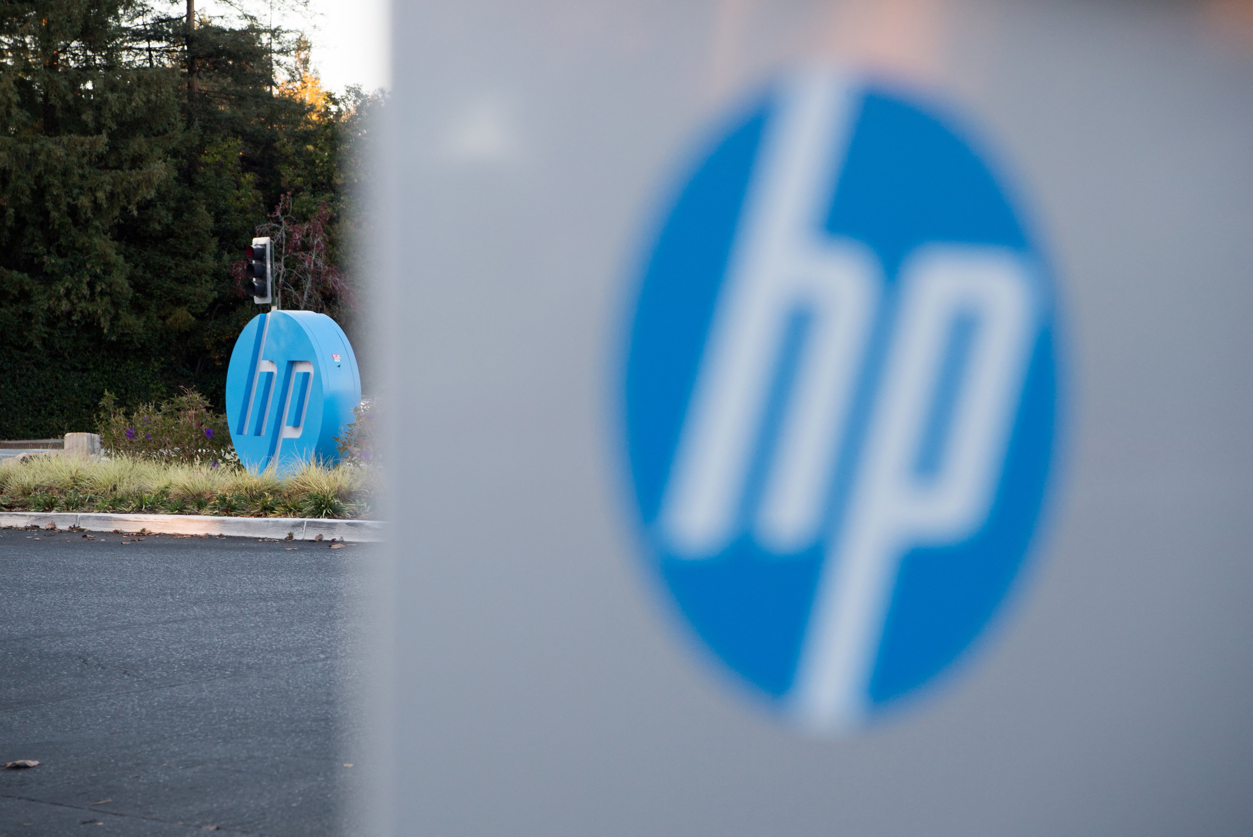 The HP logo is seen on a sign at Hewlett Packard's headquarters in Palo Alto, California on November 4, 2016. (Photo by JOSH EDELSON / AFP)