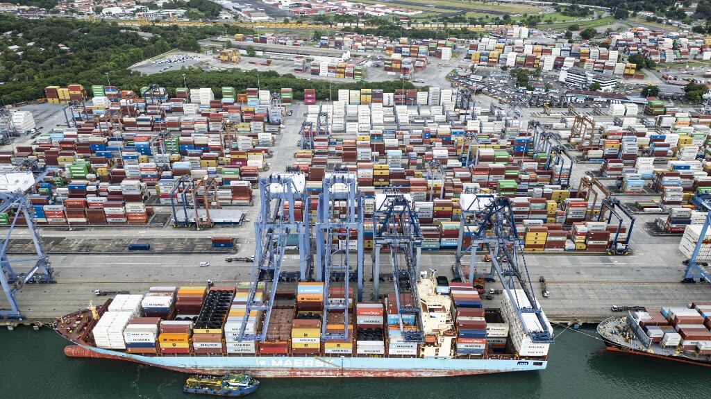 (FILES) This aerial view shows the Port of Balboa at the Pacific entrance of the Panama Canal in Panama City on October 6, 2025. The subsidiary of Hong Kong-based CK Hutchison, Panama Ports Company (PPC), announced on February 3 that it had initiated international arbitration proceedings against Panama after the Central American country's courts revoked the concession allowing it to operate two ports on the interoceanic canal. (Photo by MARTIN BERNETTI / AFP)