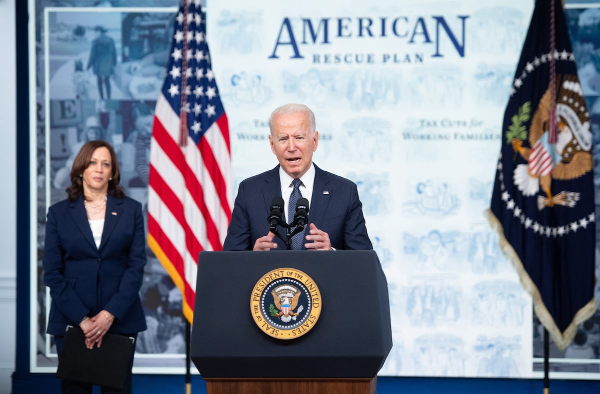US President Joe Biden speaks alongside US Vice President Kamala Harris (L) speaks about the Child Tax Credit relief payments that are part of the American Rescue Plan during an event in the Eisenhower Executive Office Building in Washington, DC, July 15, 2021. - The payments are schedule to start going out to families on July 15, 2021. (Photo by SAUL LOEB / AFP)