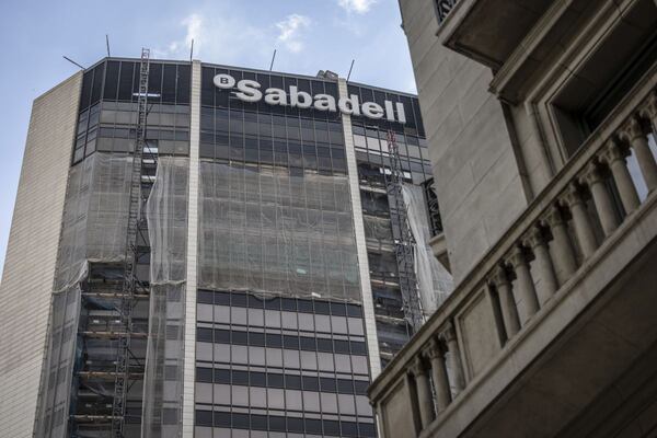 Construction netting outside the Banco Sabadell SA offices at Banc Sabadell Tower in Barcelona, Spain, on Wednesday, May 1, 2024. Banco Bilbao Vizcaya Argentaria SA (BBVA) has told Banco Sabadell SA that its interested in exploring an acquisition, in what could be one of the largest European banking deals in years. Photographer: Angel Garcia/Bloomberg