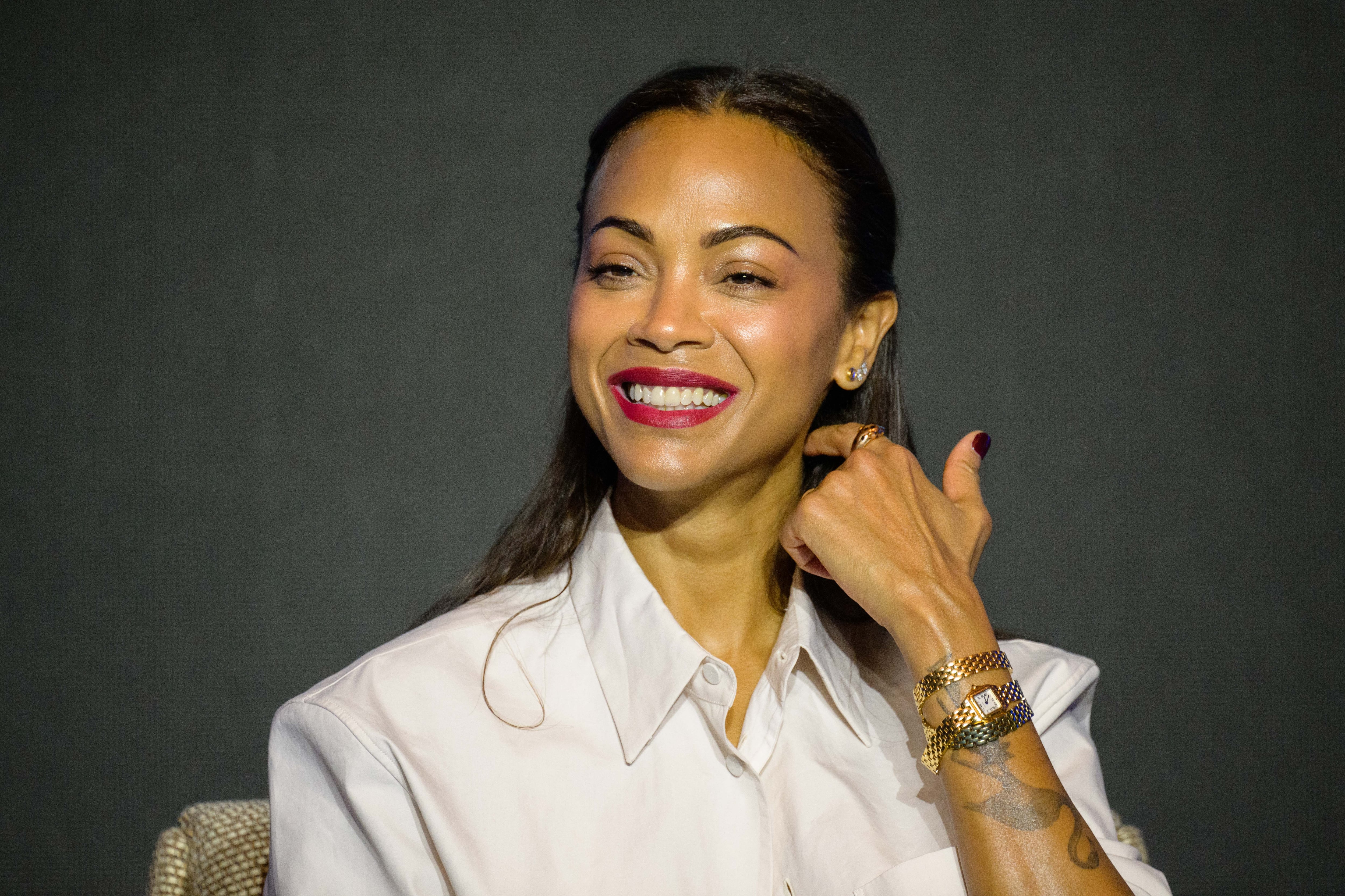 US actress Zoe Saldana reacts during a press conference to promote her new film Avatar: The Way of Water in Seoul on December 9, 2022. - (Photo by Anthony WALLACE / AFP)