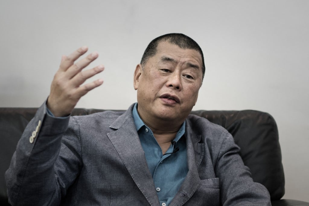 This photograph taken on June 19, 2015 shows media tycoon Jimmy Lai gesturing during an interview in Hong Kong. A Hong Kong court on February 9, 2026 sentenced pro-democracy media mogul Jimmy Lai to 20 years in prison following his high-profile national security trial that rights groups and Western nations have condemned as a symbol of the city's shrivelling press freedoms. (Photo by Philippe LOPEZ / AFP)