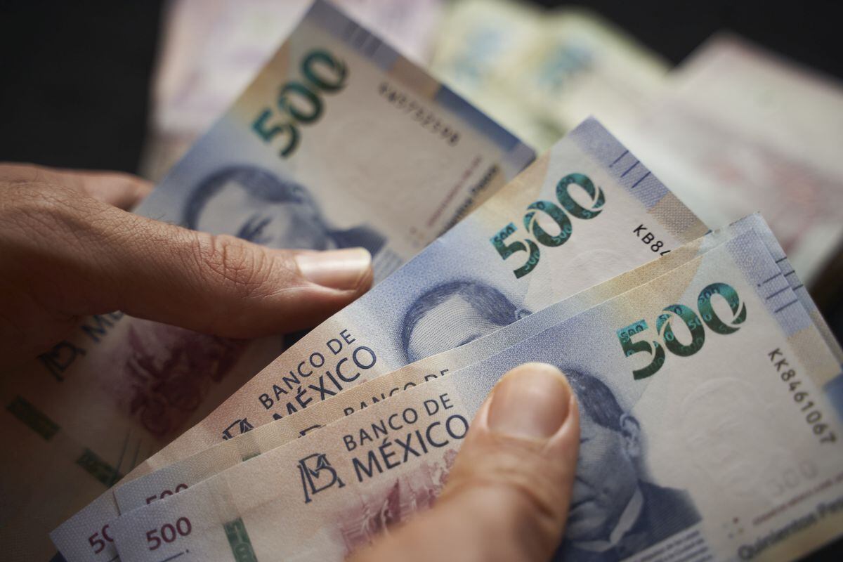 Mexican 500 peso banknotes arranged in Axtla de Terrazas, San Luis Potosi, Mexico, on Sunday, April 2, 2023. The Mexican peso is down 0.2% after inflation came in marginally below estimates, strengthening the view that the monetary tightening cycle may be over.