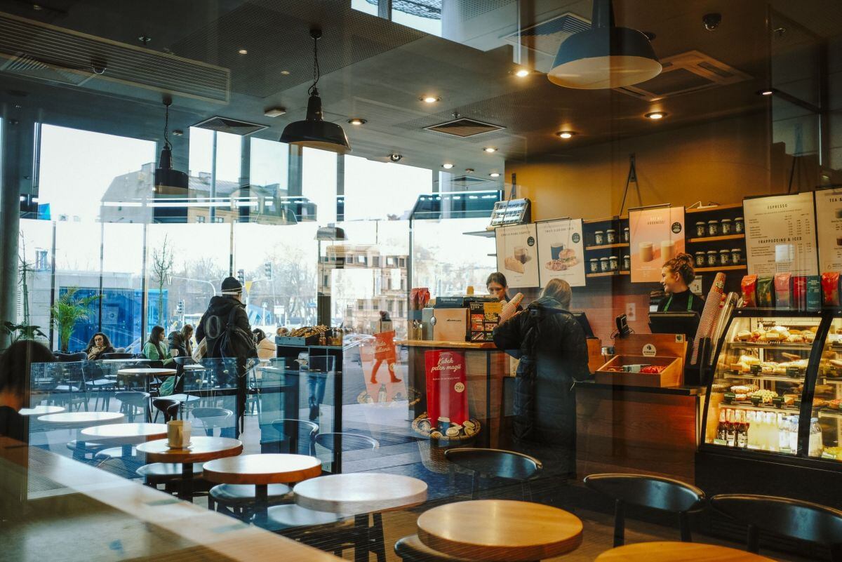 A customer orders at a Starbucks Corp. coffee store in Warsaw, Poland, on Wednesday, Jan. 4, 2023. Poland left borrowing costs unchanged as the threat of an economic recession overshadows concerns over the highest inflation in more than a quarter century.