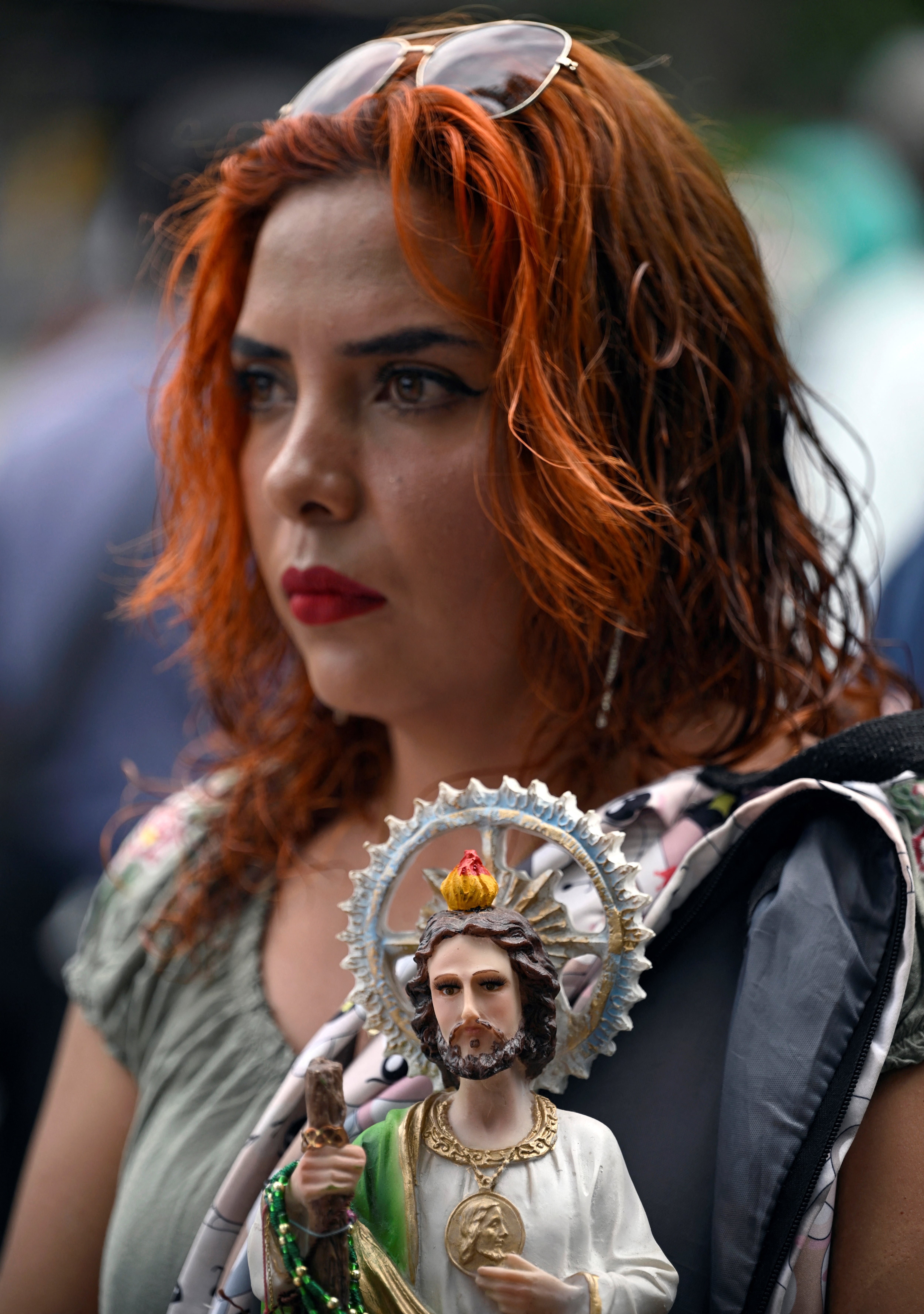 Faithfuls queue outside of the Church of San Hipolito while waiting to visit the relic of Saint Jude Thaddeus, in Mexico City on August 1, 2024. Thousands of faithful flocked to this venue to ask for favors and express their devotion to the relic of Saint Jude Thaddeus, which consists of a bone from one of his arms, and which will tour several parishes in the country. (Photo by ALFREDO ESTRELLA / AFP)