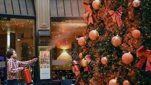 Climate activists throw orange paint on Gucci Christmas tree in Milan